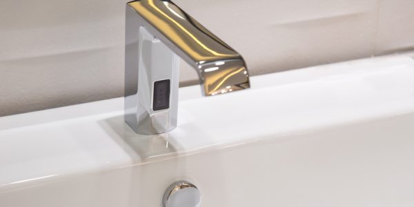 Bathroom faucet in polished chrome powered automatic by sensor. object about home Improvement.